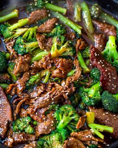 Beef and broccoli meal prep with tender sliced beef, crisp broccoli florets in savory brown sauce.